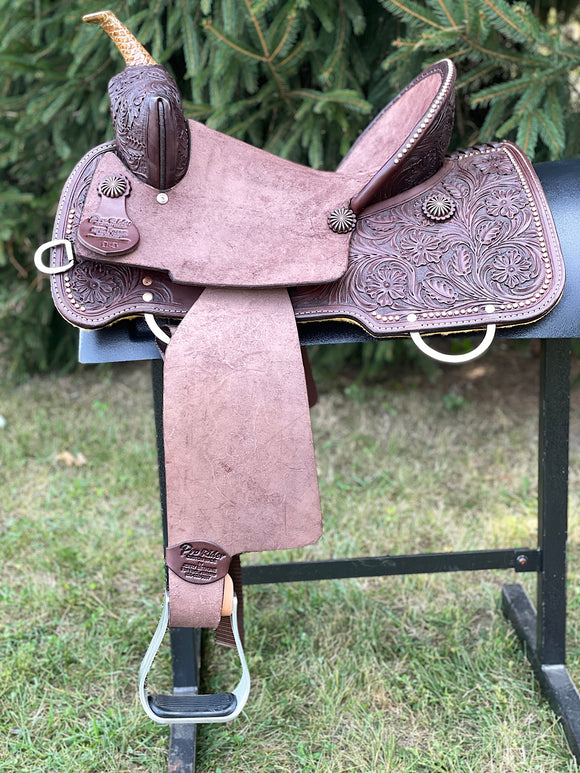 New 14 inch hard seat Pro Rider barrel saddle with copper pinwheel conchos and 4.5 inch pencil roll cantle with copper dots