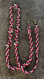 Extra thick and knotted, tri color of red, black and white barrel racing rein with snaps on the ends